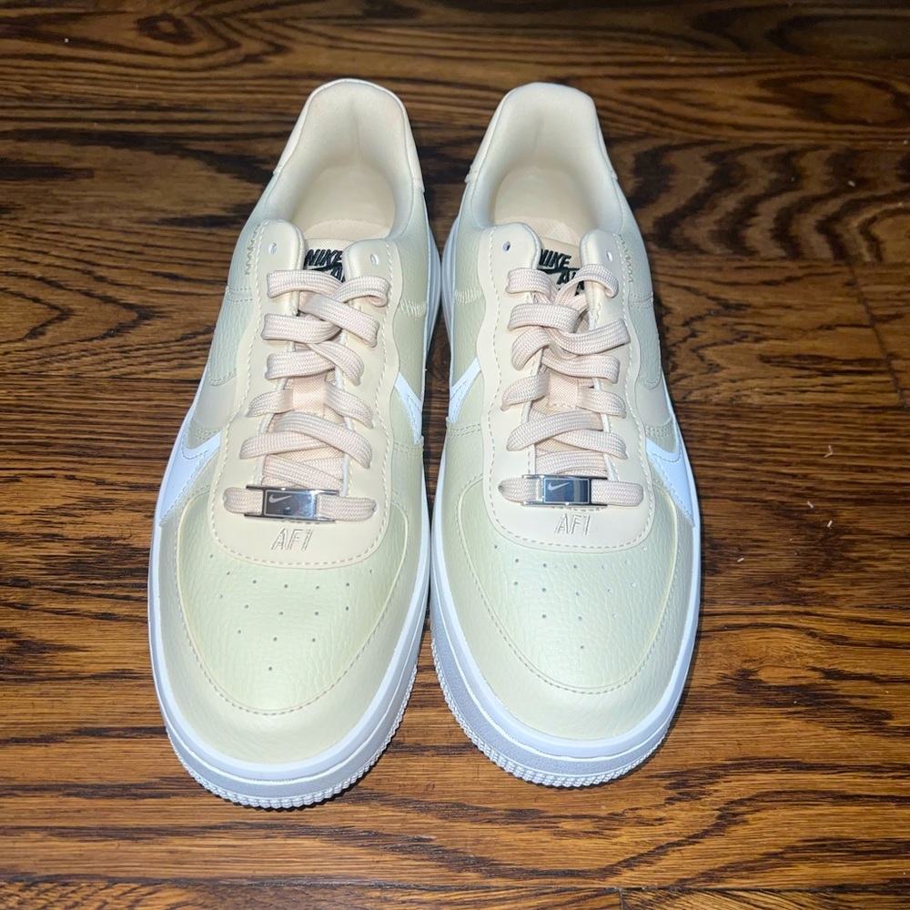 latform Nike Air Force 1. Yellow/cream color with white nike swoop. Size 7.